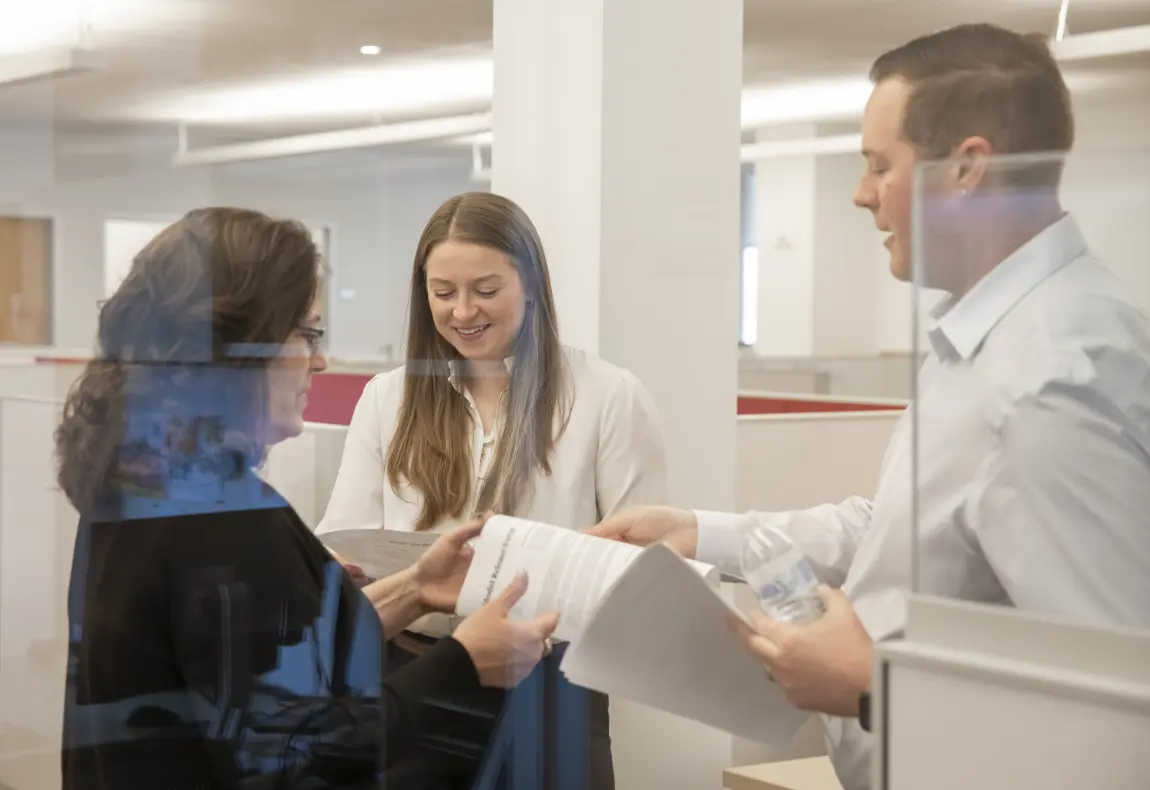 Meeting of coworkers in hallway