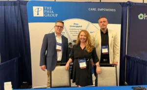 The Phia Group's: Cindy, Matt, and Scott at a booth for NOPLG