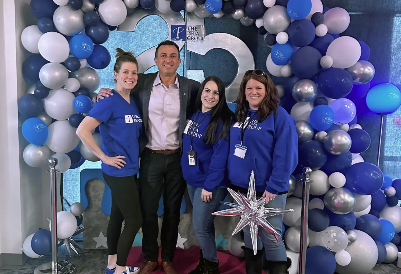 Adam Adam with 3 Women Employees at 25th Anniversary Event