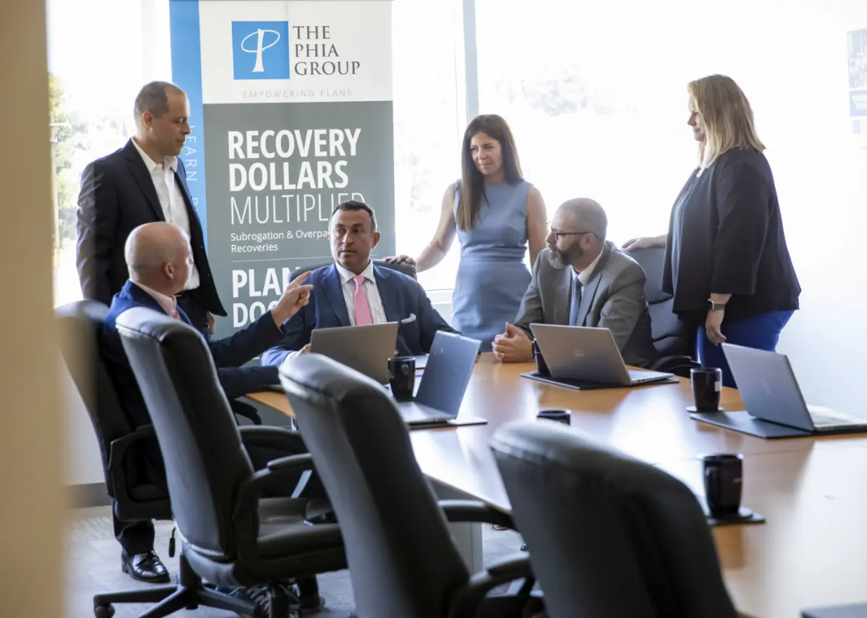Group of Phia Employees around a Conference Table