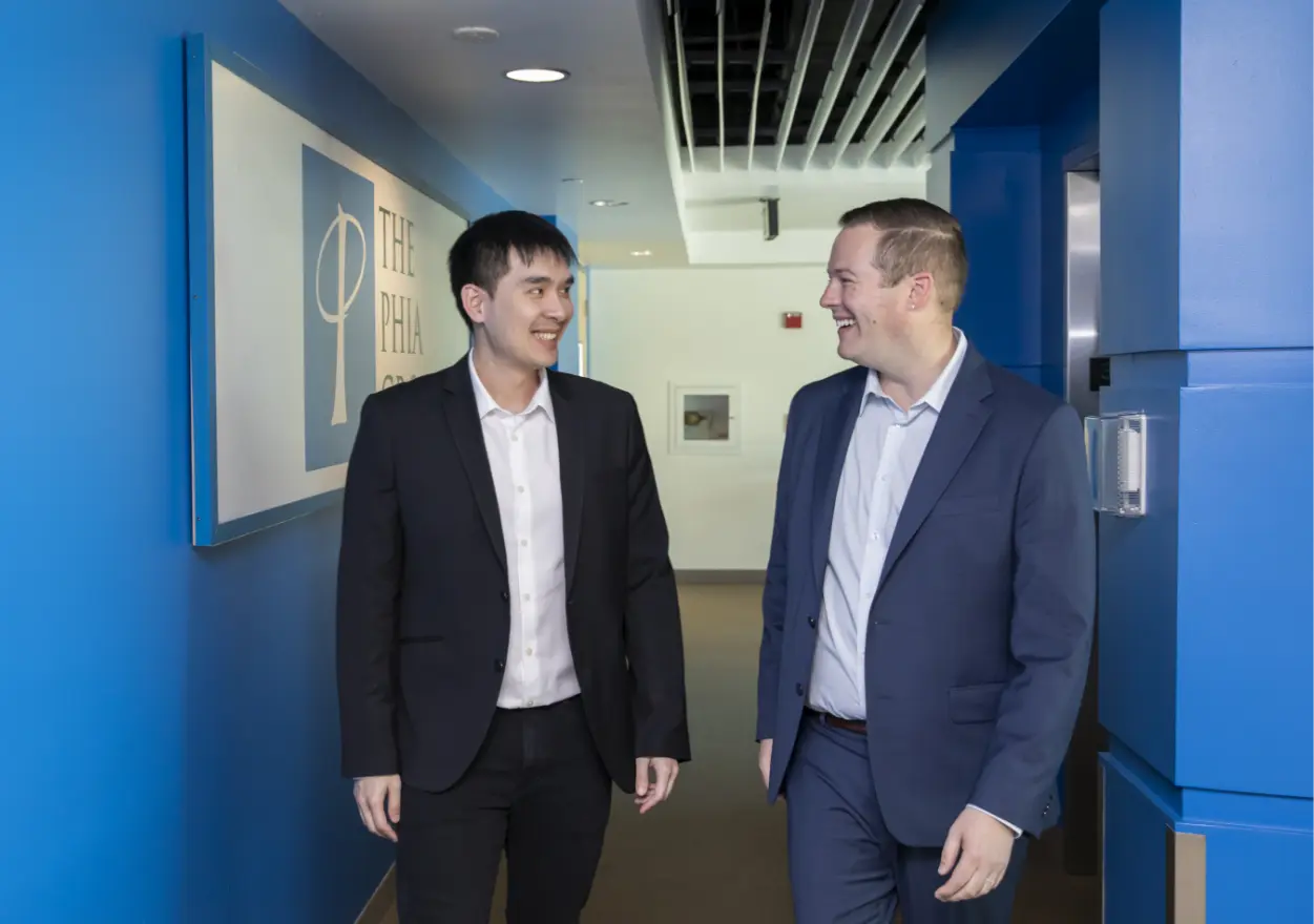 coworkers discussing in hall.