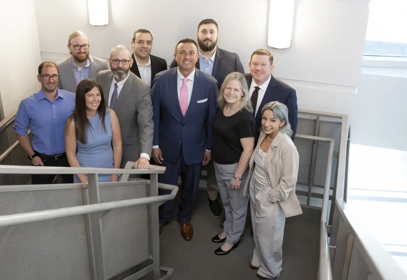 Group of Phia employees photographed at stairwell